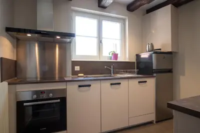 Cuisine ou kitchenette dans l'établissement Les Demeures du Tonnelier ''La Maison Pini''