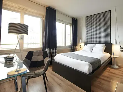 Un ou plusieurs lits dans un hébergement de l'établissement L'aparthoteL LhL