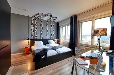 Un ou plusieurs lits dans un hébergement de l'établissement L'aparthoteL LhL