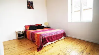 Un ou plusieurs lits dans un hébergement de l'établissement Le Corton de Beaune, appartement classé 3 étoiles