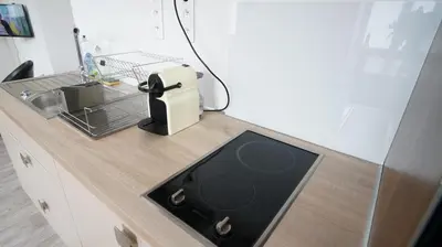 Cuisine ou kitchenette dans l'établissement Le Corton de Beaune, appartement classé 3 étoiles