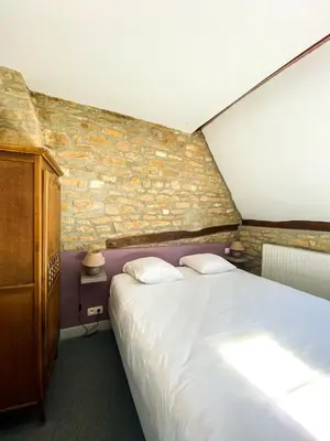 Un ou plusieurs lits dans un hébergement de l'établissement Hostellerie Du Chateau