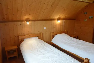 Un ou plusieurs lits dans un hébergement de l'établissement chalet des planchettes