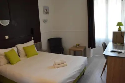 Un ou plusieurs lits dans un hébergement de l'établissement Hôtel de la Colombière