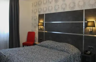 Un ou plusieurs lits dans un hébergement de l'établissement Hostellerie St Vincent