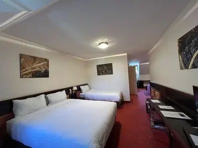 Un ou plusieurs lits dans un hébergement de l'établissement Hostellerie St Vincent