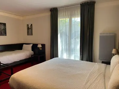 Un ou plusieurs lits dans un hébergement de l'établissement Hostellerie St Vincent