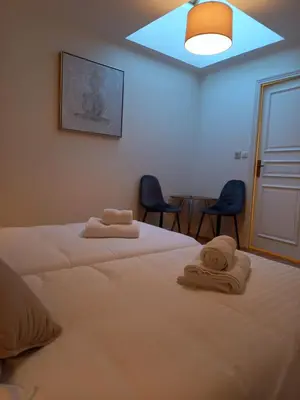 Un ou plusieurs lits dans un hébergement de l'établissement Hotel de la Halle