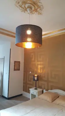 Un ou plusieurs lits dans un hébergement de l'établissement Luxury Suite lilas 3