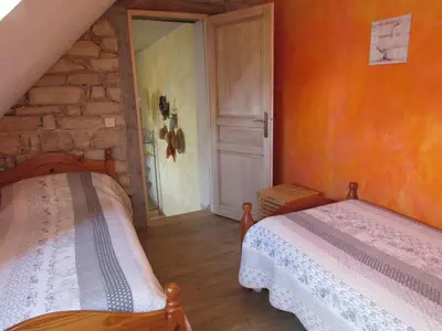 Un ou plusieurs lits dans un hébergement de l'établissement Chambres d'hôtes Les Arondelles