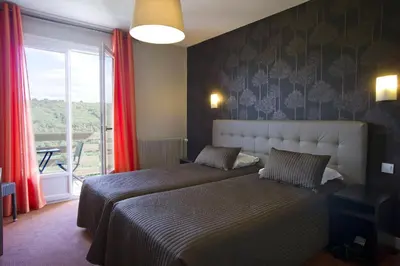 Un ou plusieurs lits dans un hébergement de l'établissement Auberge Du Camp Romain