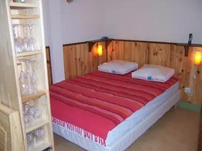 Un ou plusieurs lits dans un hébergement de l'établissement La maison de poupet