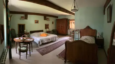 Un ou plusieurs lits dans un hébergement de l'établissement CHAMBRES D' HOTES LA LISON