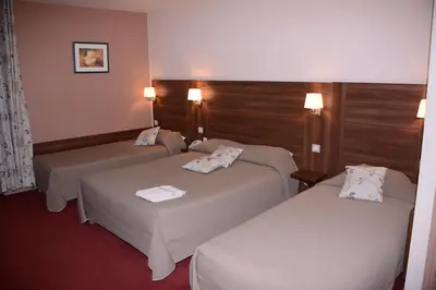 Un ou plusieurs lits dans un hébergement de l'établissement Hôtel de Bourgogne