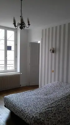 Un ou plusieurs lits dans un hébergement de l'établissement Gite Au Coeur De Volnay