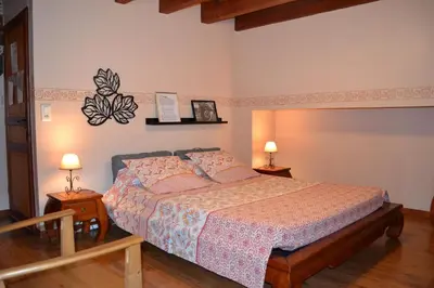 Un ou plusieurs lits dans un hébergement de l'établissement Chambres d'Hôtes Le Moulin à Epices
