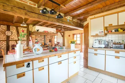 Cuisine ou kitchenette dans l'établissement La Maison du Bonheur
