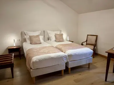 Un ou plusieurs lits dans un hébergement de l'établissement Hotel Le Manasses