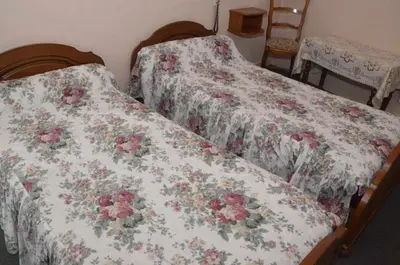 Un ou plusieurs lits dans un hébergement de l'établissement Hotel du Commerce