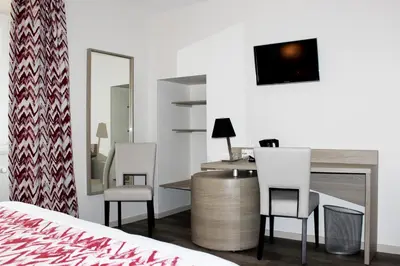 Télévision ou salle de divertissement dans l'établissement Hotel le Vauxois