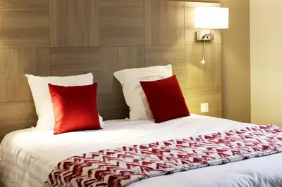 Un ou plusieurs lits dans un hébergement de l'établissement Hotel le Vauxois