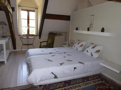 Un ou plusieurs lits dans un hébergement de l'établissement Chambres d'Hotes à La Chandelle