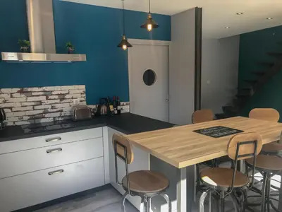 Cuisine ou kitchenette dans l'établissement Le jardin des Arums