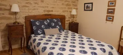 Un ou plusieurs lits dans un hébergement de l'établissement La Maison de l'Escargot