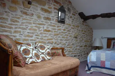Un ou plusieurs lits dans un hébergement de l'établissement Le Lavoir de Meziat