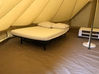 Un ou plusieurs lits dans un hébergement de l'établissement Camping Le Canoë