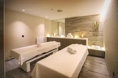 Un ou plusieurs lits dans un hébergement de l'établissement HÔTEL & SPA Panorama 360