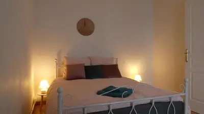 Un ou plusieurs lits dans un hébergement de l'établissement RnB Locations Mâcon