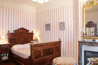 Un ou plusieurs lits dans un hébergement de l'établissement Chambres d'hôtes La Distillerie B&B