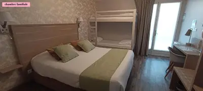 Un ou plusieurs lits dans un hébergement de l'établissement Hôtel Le Clos Badan
