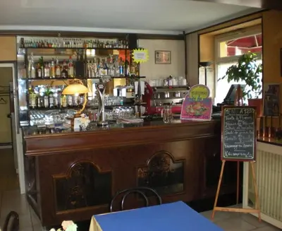 Salon ou bar de l'établissement Aux Quatre Vents