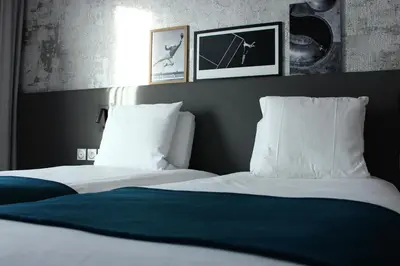 Un ou plusieurs lits dans un hébergement de l'établissement BEST WESTERN HOTEL DIJON QUETIGNY