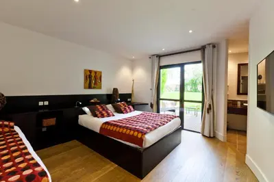 Un ou plusieurs lits dans un hébergement de l'établissement Hôtel Auberge de Chavannes