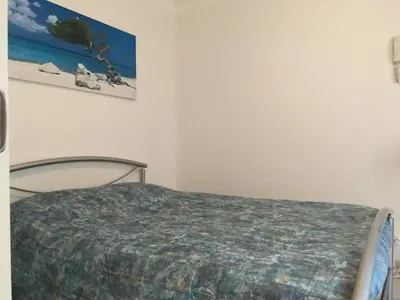 Un ou plusieurs lits dans un hébergement de l'établissement Chambre du verger