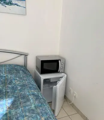 Un ou plusieurs lits dans un hébergement de l'établissement Chambre du verger