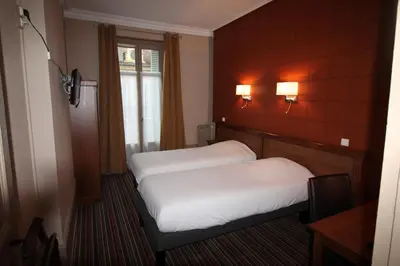 Un ou plusieurs lits dans un hébergement de l'établissement Hotel Le Jacquemart