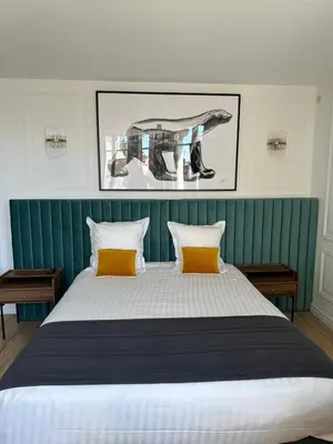Un ou plusieurs lits dans un hébergement de l'établissement City Loft Apparthotel