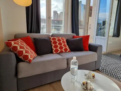 Coin salon dans l'établissement City Loft Apparthotel
