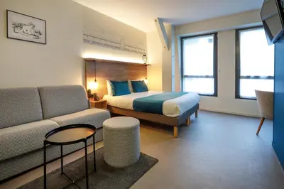 Un ou plusieurs lits dans un hébergement de l'établissement Hôtel des Halles