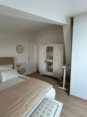 Un ou plusieurs lits dans un hébergement de l'établissement Les chambres claires Givry
