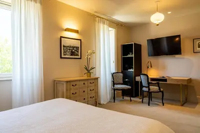 Un ou plusieurs lits dans un hébergement de l'établissement Olivier Leflaive Hôtel Restaurants