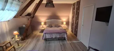 Un ou plusieurs lits dans un hébergement de l'établissement une Pause à la Campagne