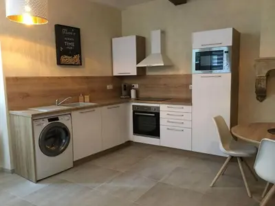 Cuisine ou kitchenette dans l'établissement Chez Maufoux - Centre - Hospices - Climatisation