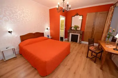 Un ou plusieurs lits dans un hébergement de l'établissement Hôtel De La Ferté