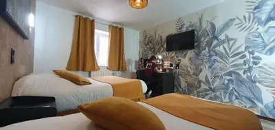 Télévision ou salle de divertissement dans l'établissement Hôtel du Moulin de la Brevette
