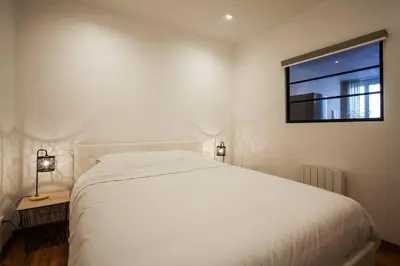 Un ou plusieurs lits dans un hébergement de l'établissement Legend - Le Saint Laurent - Parking - Wifi - 24/7 - cosy